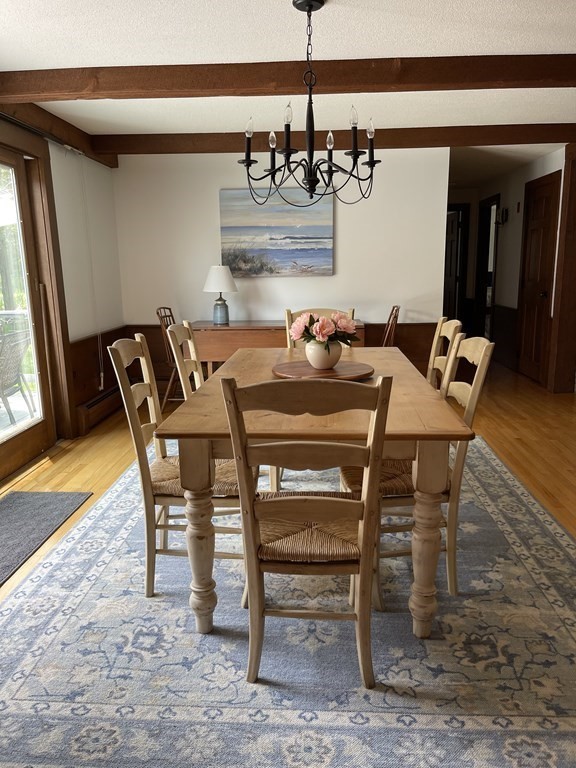 12 Seavers Road Orleans, MA 02653 - Photo 6 of 18 a view of a dining room with furniture and a chandelier