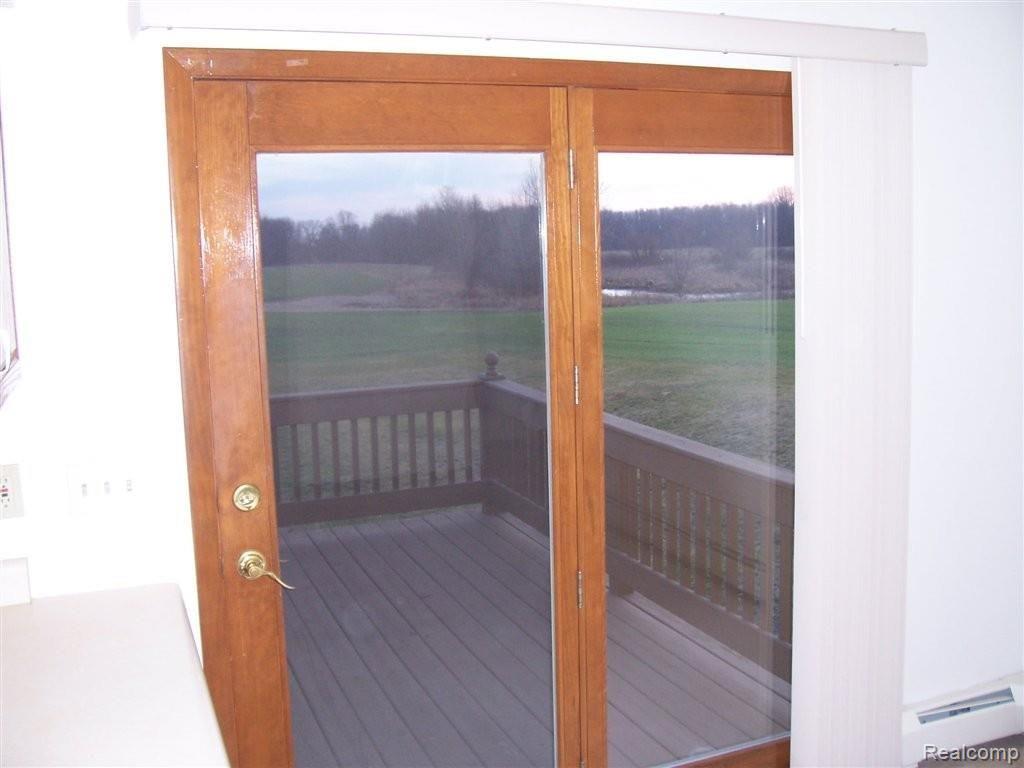 7501 West Lovejoy Road Byron, MI 48418 - Photo 16 of 24 dining to deck