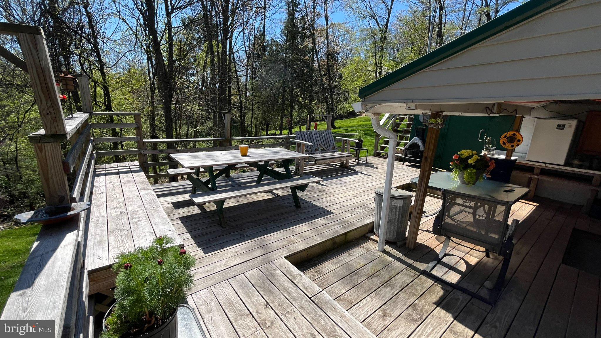 2290 Purdue Mountain Road Bellefonte, PA 16823 - Photo 24 of 48 Sunny deck retreat in nature's embrace.