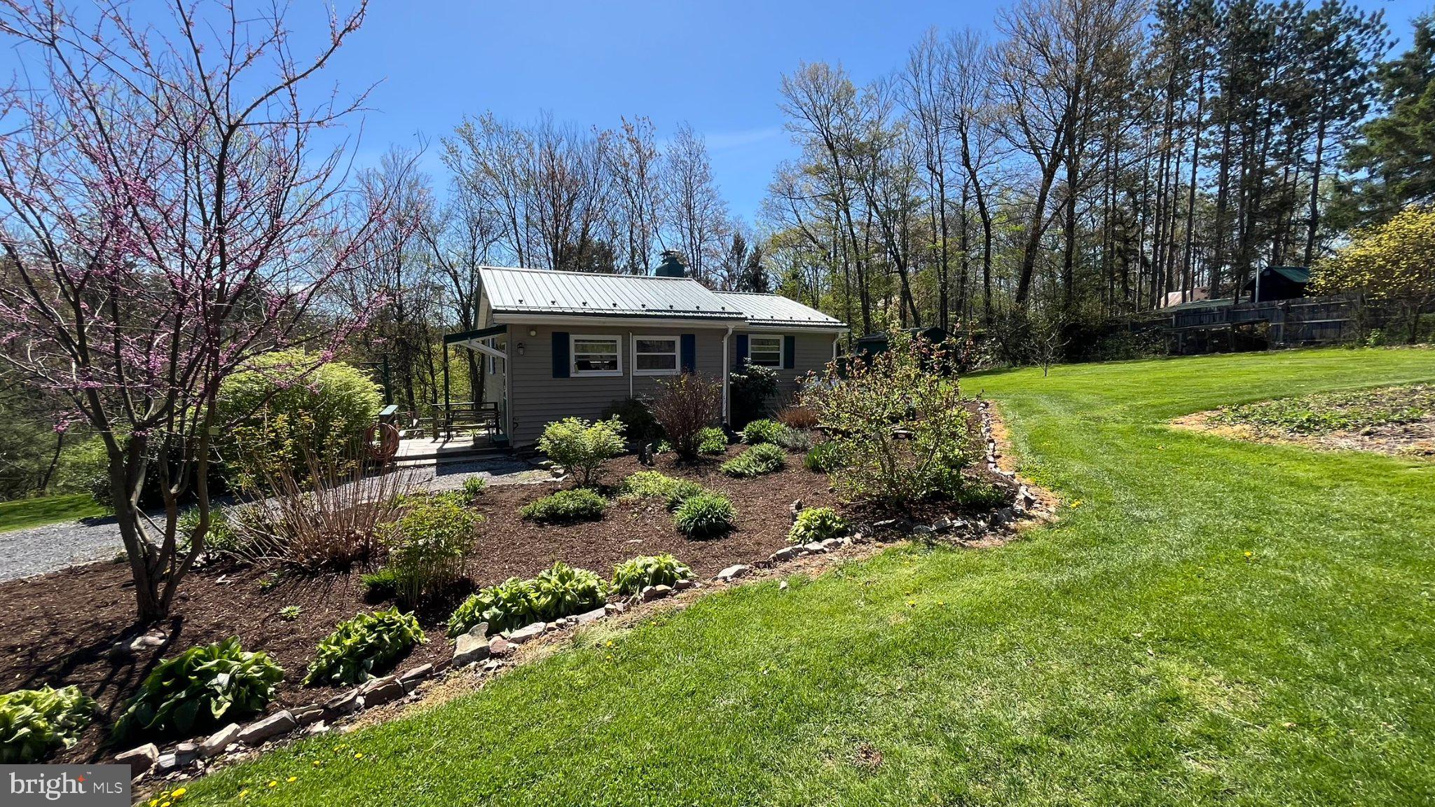 2290 Purdue Mountain Road Bellefonte, PA 16823 - Photo 34 of 48 Charming cottage amid lush greenery.