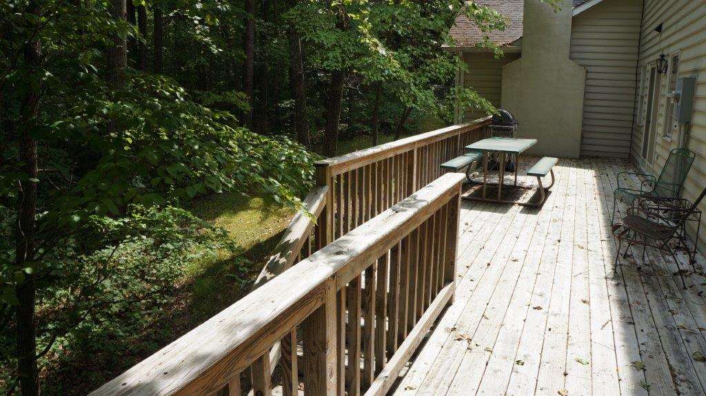286 Beazley Road Ruckersville, VA 22968 - Photo 12 of 50 a view of balcony with wooden floor and fence