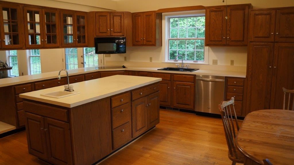 286 Beazley Road Ruckersville, VA 22968 - Photo 27 of 50 a kitchen with a sink cabinets and a window