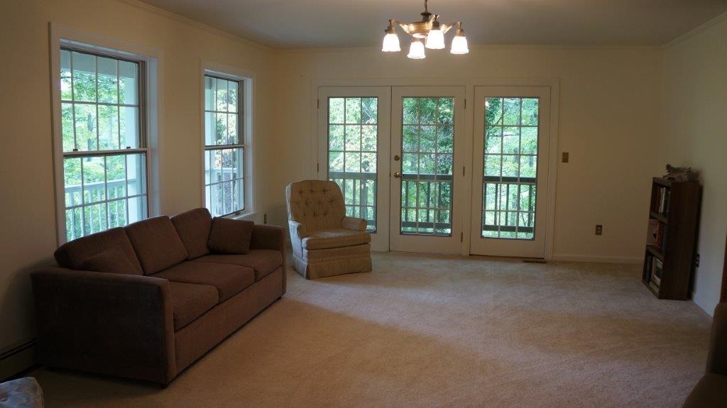 286 Beazley Road Ruckersville, VA 22968 - Photo 36 of 50 a living room with furniture and a large window