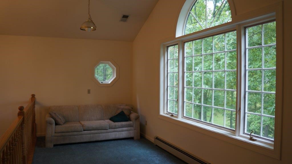 286 Beazley Road Ruckersville, VA 22968 - Photo 39 of 50 a living room with furniture and a window
