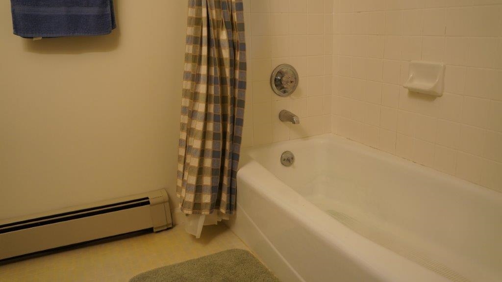 286 Beazley Road Ruckersville, VA 22968 - Photo 45 of 50 a bathroom with a tub and a shower