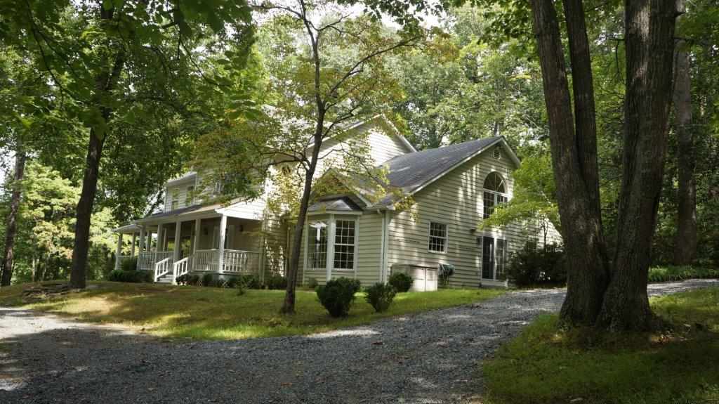 286 Beazley Road Ruckersville, VA 22968 - Photo 8 of 50 a front view of a house with a garden