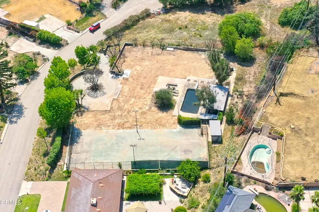 an aerial view of residential house with outdoor space
