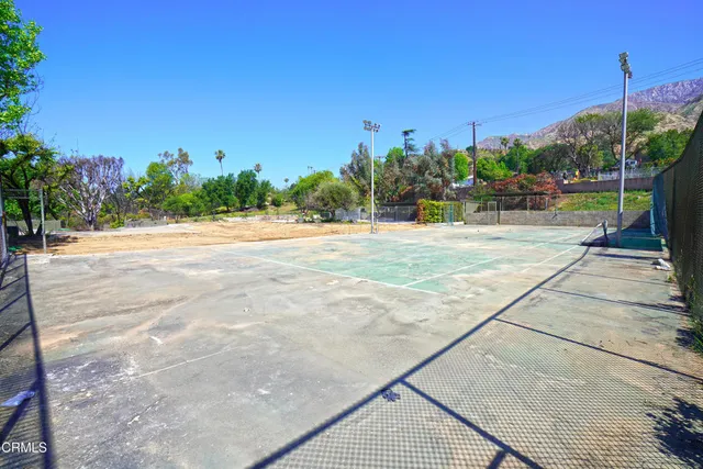 a view of pool with a yard