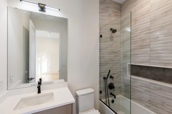 a kitchen with a refrigerator and a sink