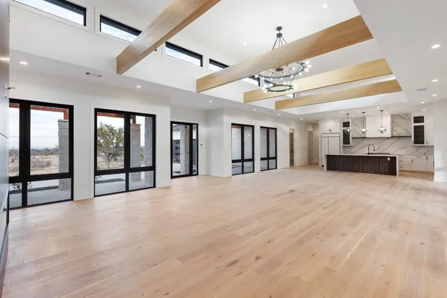 a spacious bathroom with a granite countertop sink and a mirror