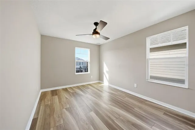 a view of empty room with windows