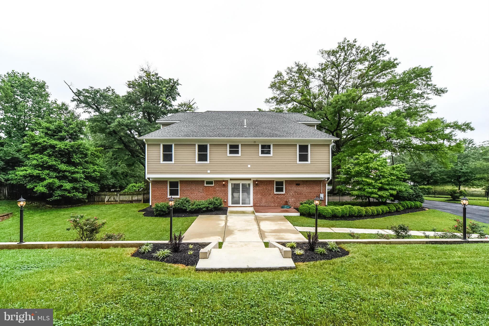 506 Midland Road Silver Spring, MD 20904 - Photo 2 of 28 a front view of a house with a yard table and chairs
