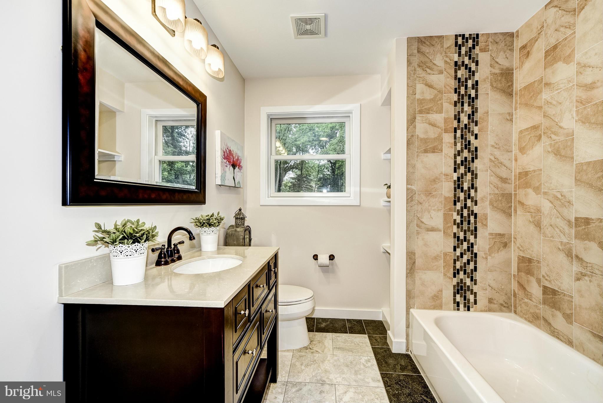 506 Midland Road Silver Spring, MD 20904 - Photo 12 of 28 a bathroom with a sink a toilet and a bathtub