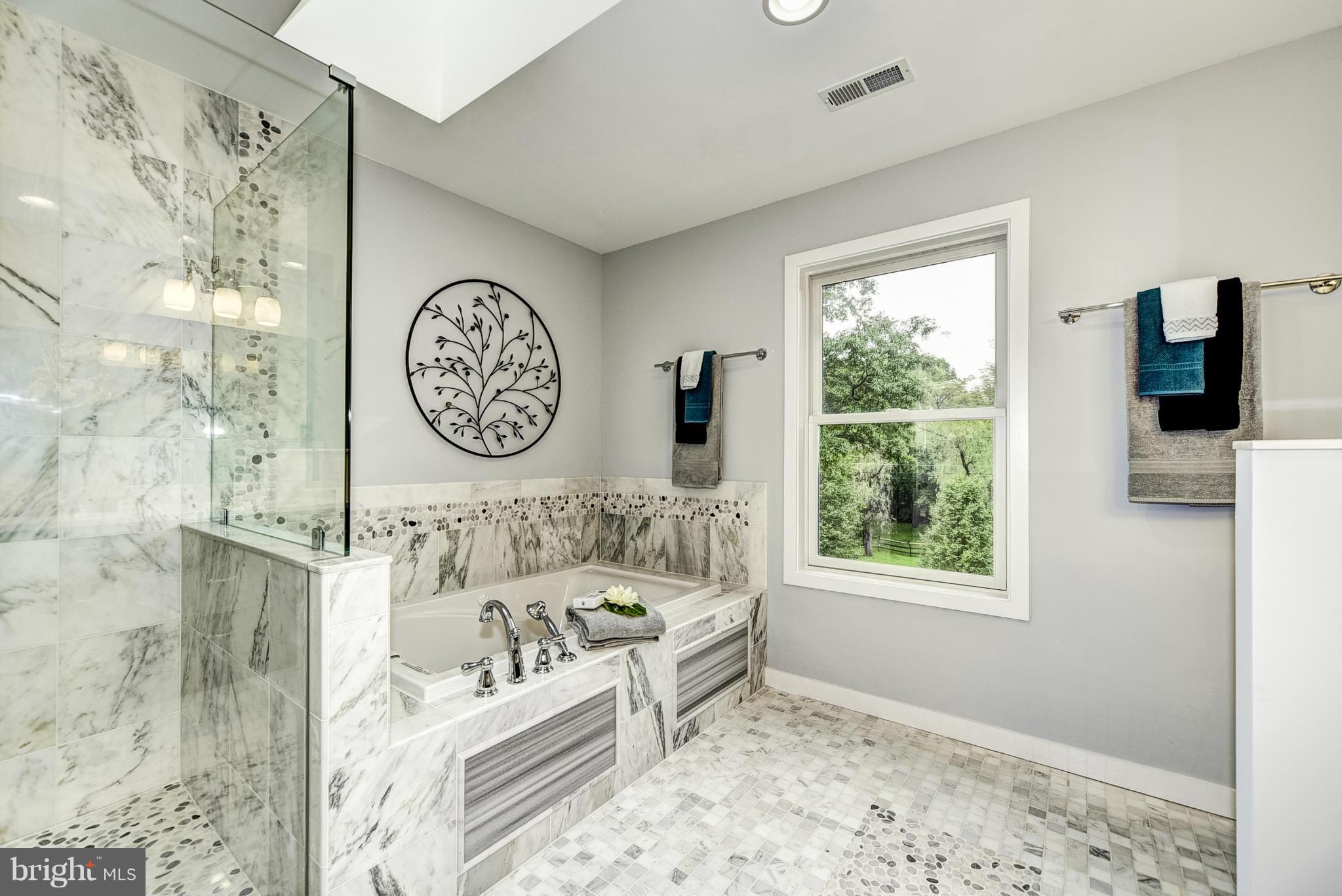 506 Midland Road Silver Spring, MD 20904 - Photo 13 of 28 a bathroom with a bathtub and a window