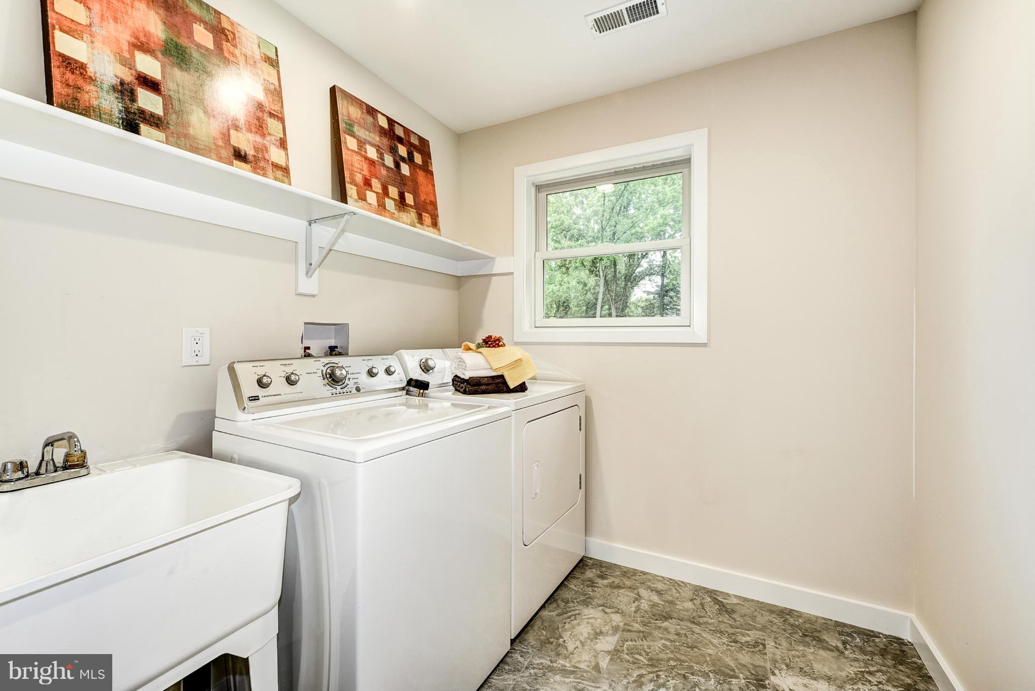506 Midland Road Silver Spring, MD 20904 - Photo 14 of 28 a utility room with dryer and washer