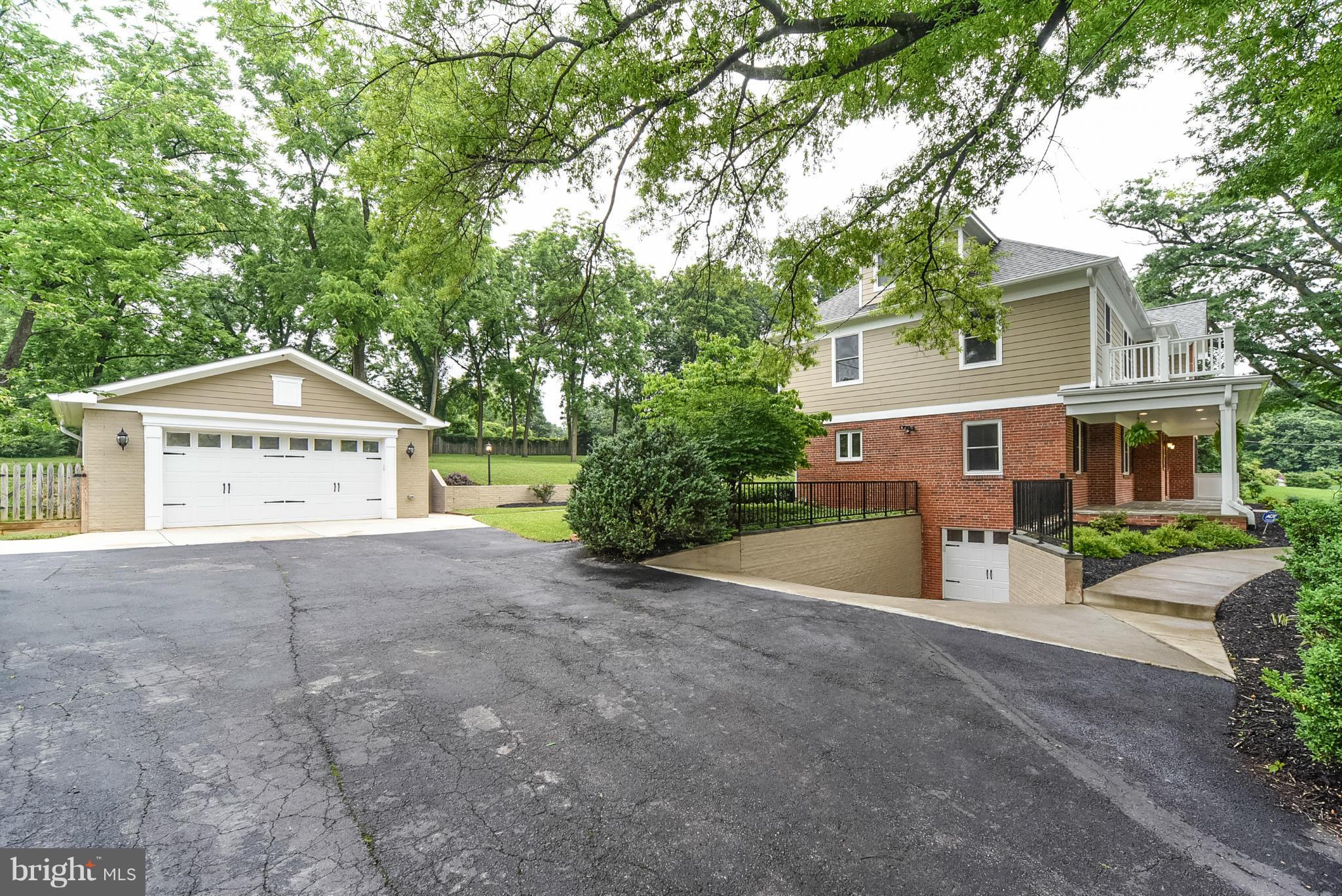 506 Midland Road Silver Spring, MD 20904 - Photo 3 of 28 a view of a house with a yard and garage