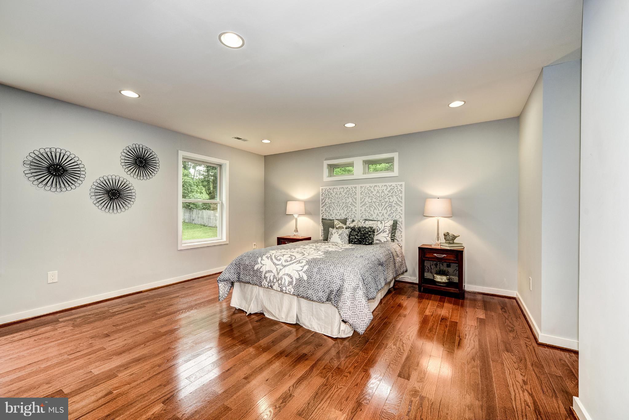 506 Midland Road Silver Spring, MD 20904 - Photo 26 of 28 a spacious bedroom with a large bed and a window