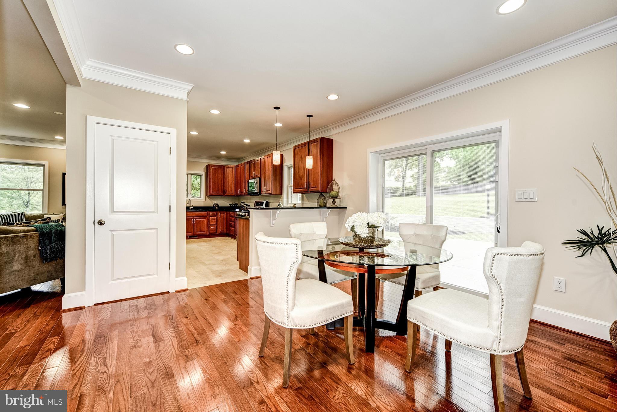 506 Midland Road Silver Spring, MD 20904 - Photo 6 of 28 a view of a dining room with furniture and wooden floor