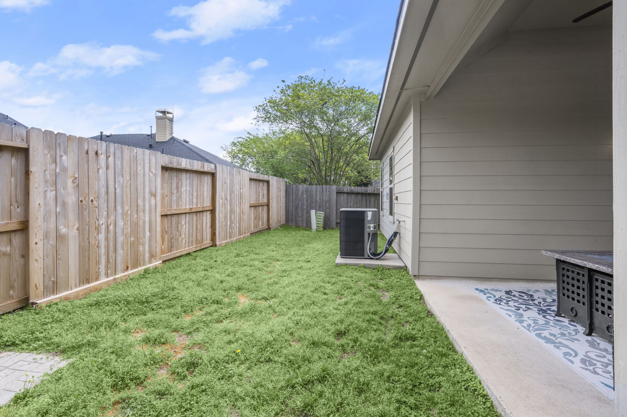 27526 Gatlin Lane Spring, TX 77386 - Photo 16 of 31 Cozy backyard with a wooden privacy fence, perfect for relaxation and gatherings.