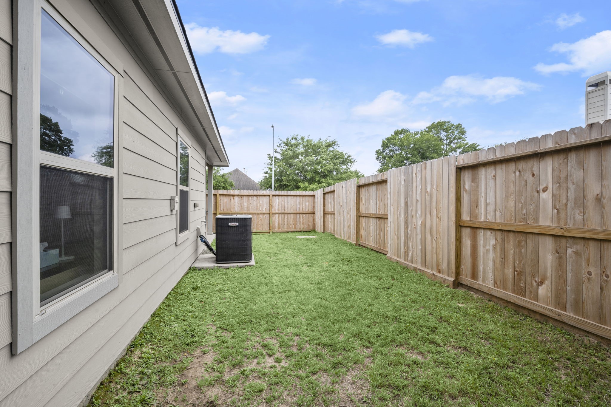 27526 Gatlin Lane Spring, TX 77386 - Photo 18 of 31 This charming enclosed yard offers a peaceful space for gardening or relaxation.