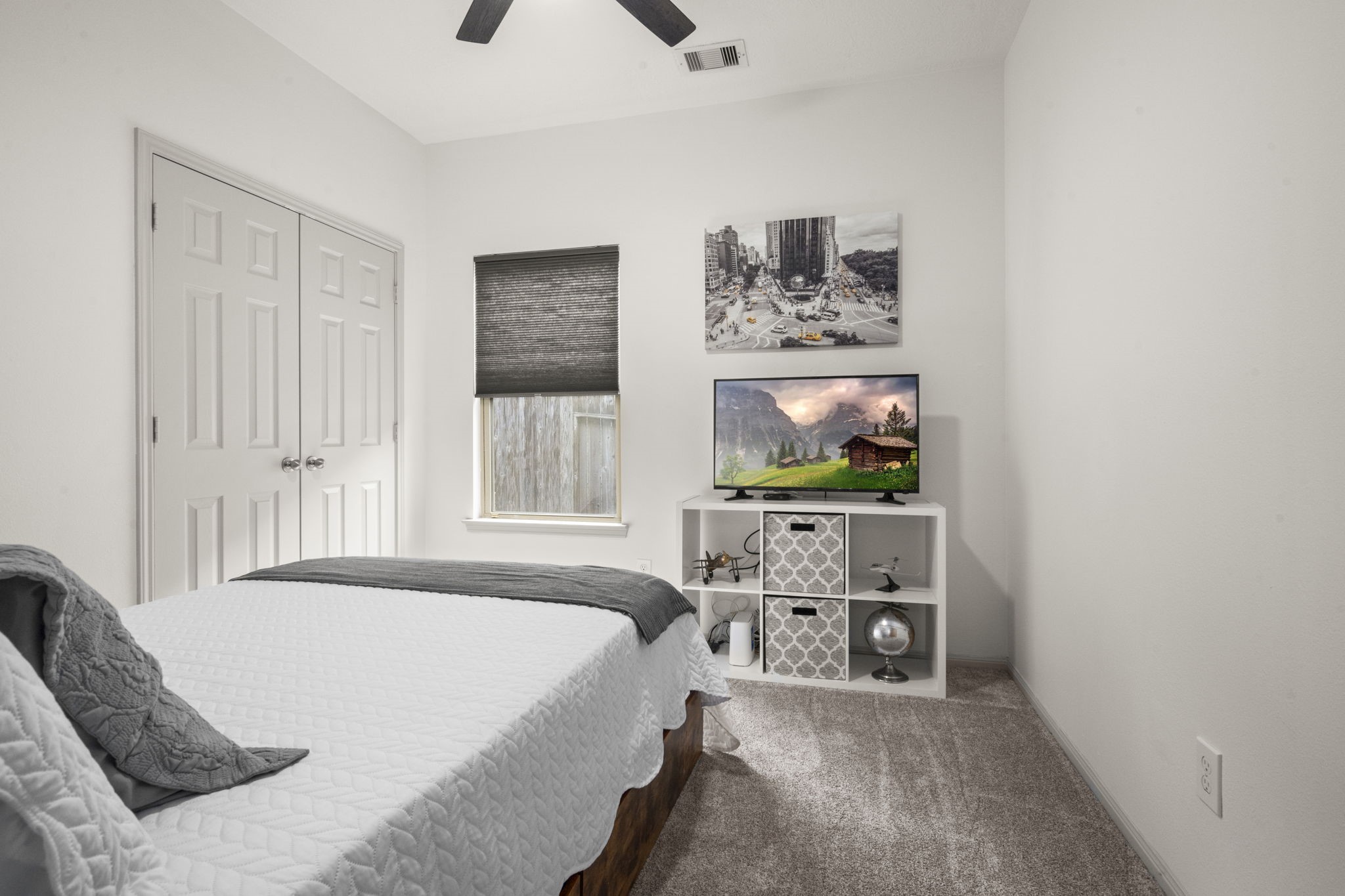 27526 Gatlin Lane Spring, TX 77386 - Photo 27 of 31 Cozy, neutral guest room featuring a double closet with ample space for storage.