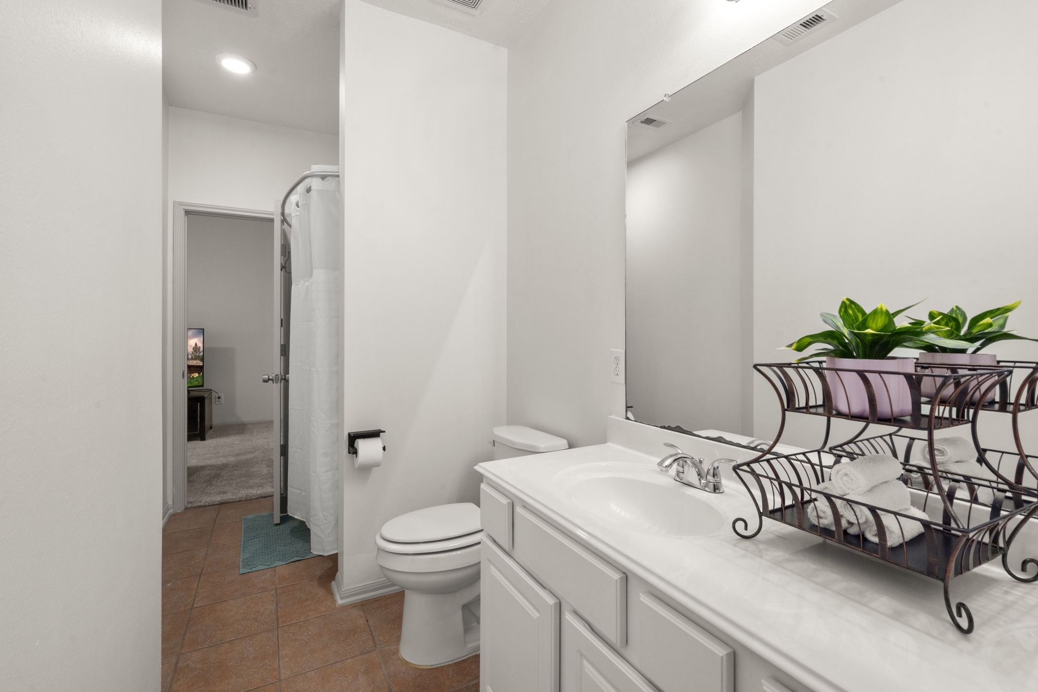 27526 Gatlin Lane Spring, TX 77386 - Photo 29 of 31 The guest bathroom is bright and connects to the family room.