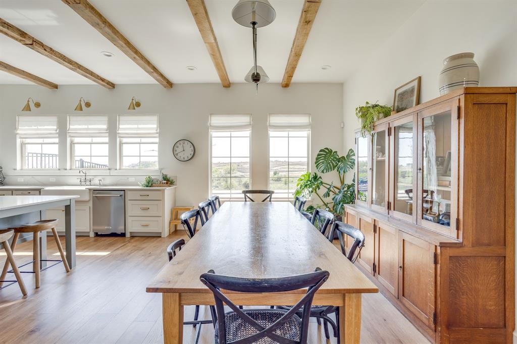 14000 Rozana Street Fort Worth, TX 76008 - Photo 14 of 38 a view of a dining room with furniture window and wooden floor