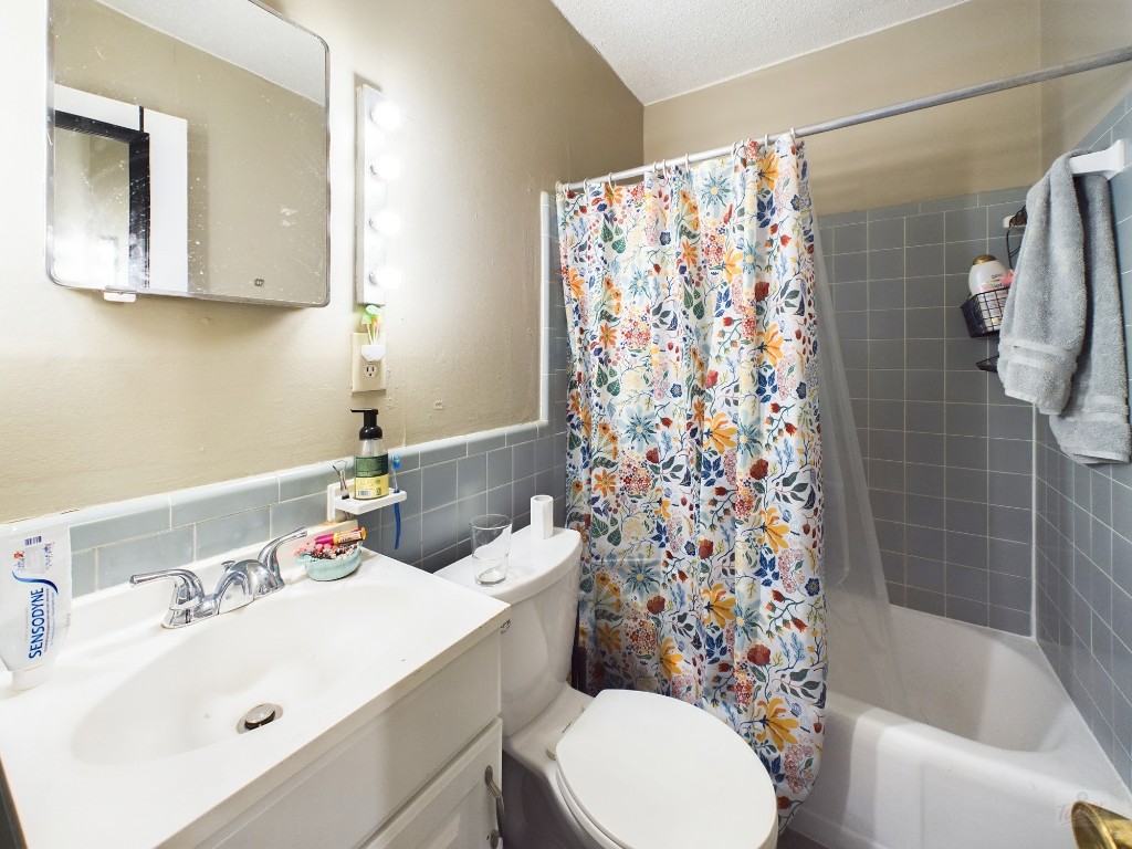803 West 28th Street, Unit 105 Austin, TX 78705 - Photo 17 of 40 a bathroom with a sink toilet and shower