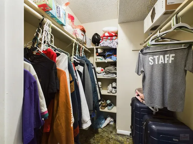 a room with lots of different colored cloths