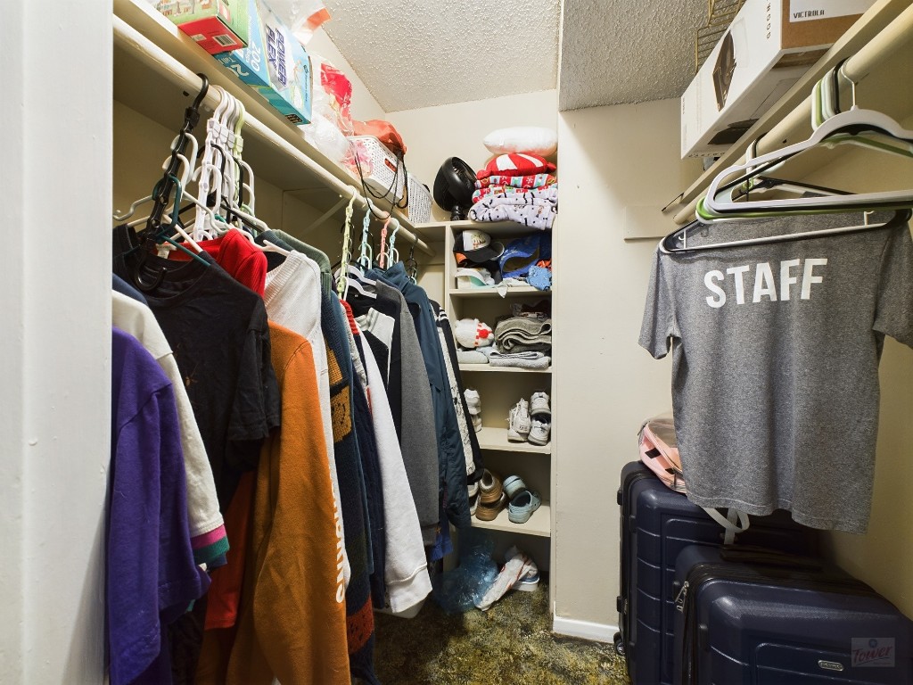 803 West 28th Street, Unit 105 Austin, TX 78705 - Photo 19 of 40 a view of walk in closet with clothes
