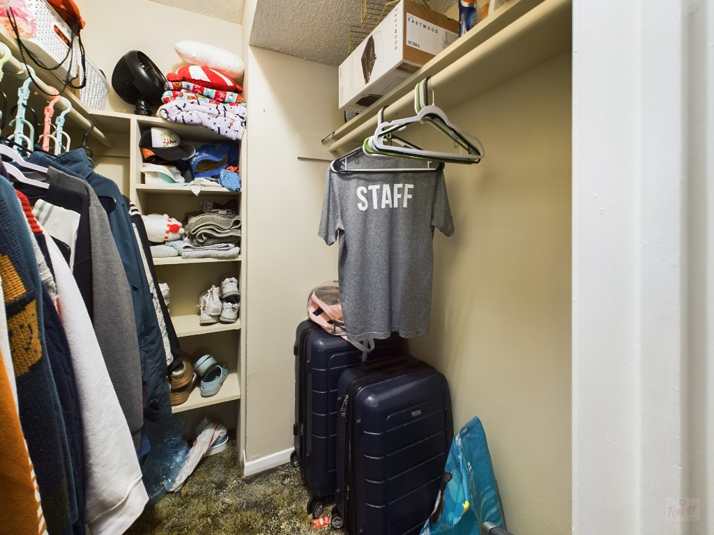 803 West 28th Street, Unit 105 Austin, TX 78705 - Photo 20 of 40 a room with lots of different colored cloths