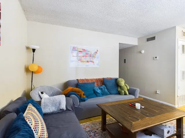 a living room with furniture and a table
