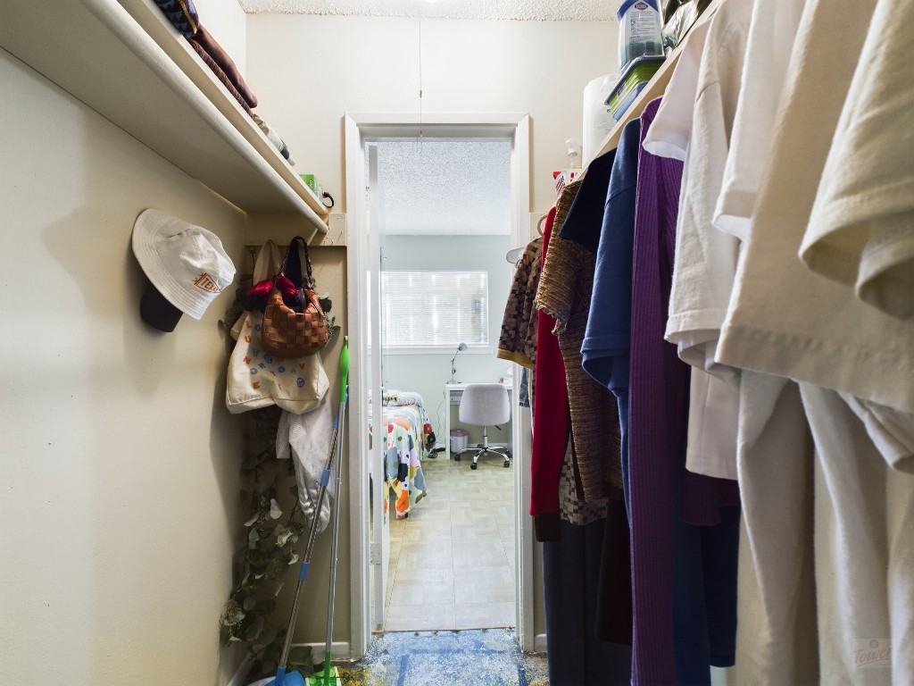 803 West 28th Street, Unit 105 Austin, TX 78705 - Photo 30 of 40 a view of walk in closet with clothes and shoes