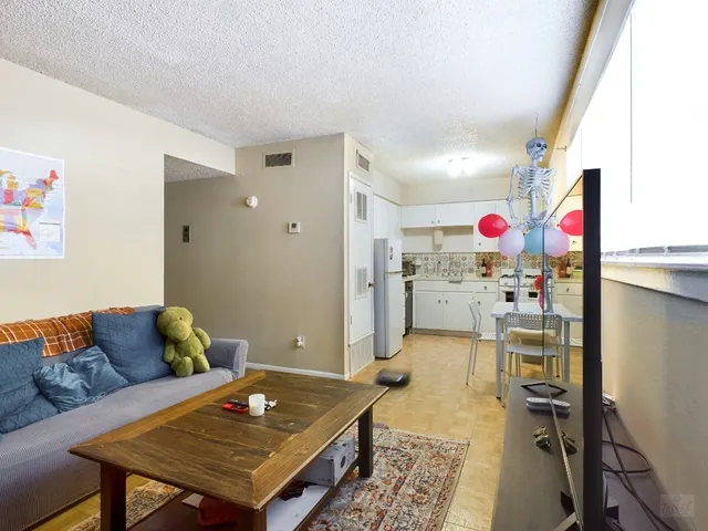 a living room with furniture and a table