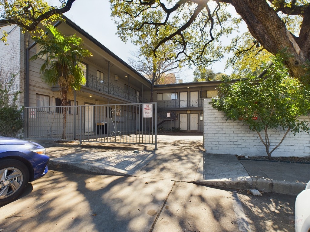 803 West 28th Street, Unit 105 Austin, TX 78705 - Photo 34 of 40 a view of a car parked in front of a house