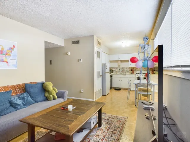 a living room with furniture and a table