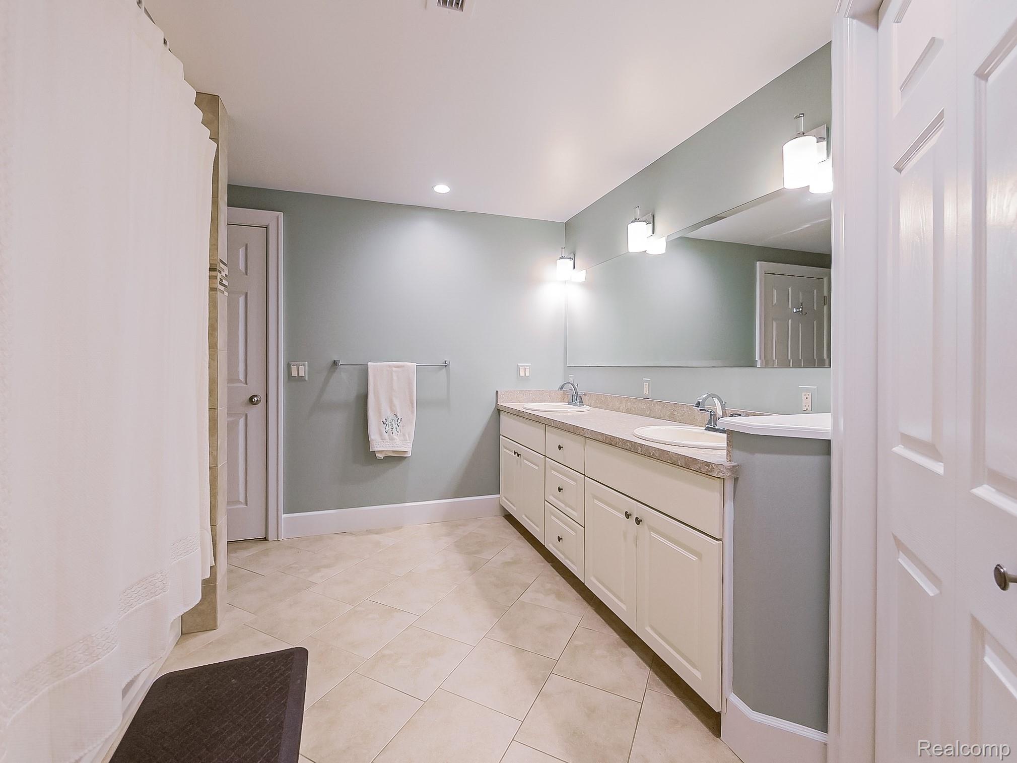 3720 East Clarkston Road Oakland, MI 48363 - Photo 36 of 60 Full bathroom with double vanity, recessed lighting, light tile patterned floors, and a shower with curtain