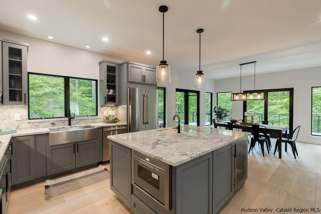 136 Bush Road Stone Ridge, NY 12484 - Photo 14 of 35 a kitchen with kitchen island a large island in it