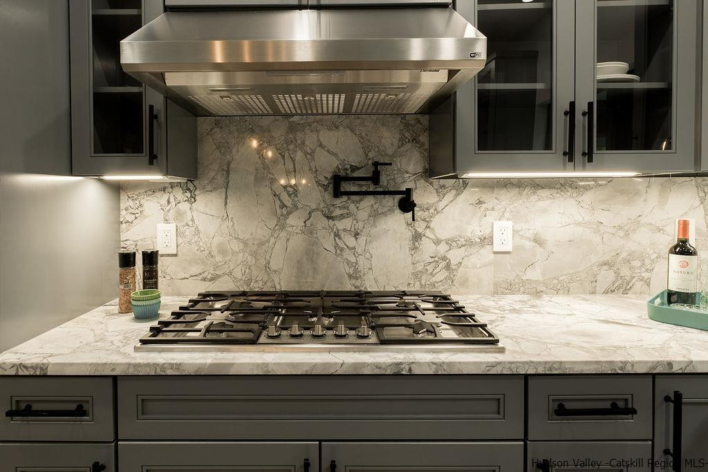 136 Bush Road Stone Ridge, NY 12484 - Photo 17 of 35 a stove top oven sitting inside of a kitchen
