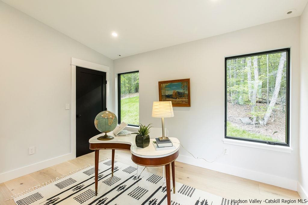 136 Bush Road Stone Ridge, NY 12484 - Photo 26 of 35 a living room with furniture and a painting on the wall