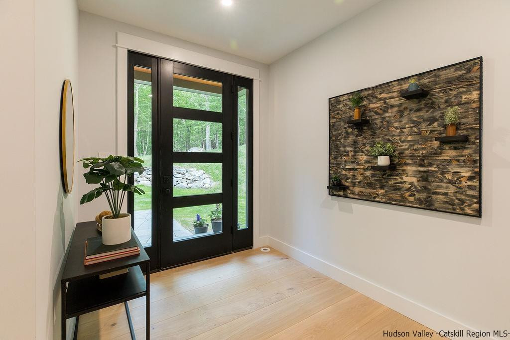 136 Bush Road Stone Ridge, NY 12484 - Photo 5 of 35 a view of an entryway with wooden floor