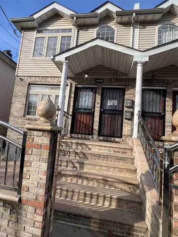 a view of a house with entrance gate