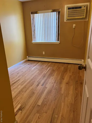 a view of an empty room with windows