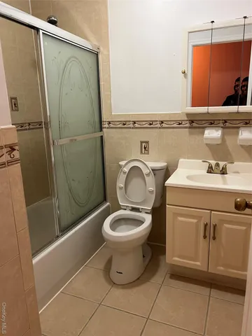 a bathroom with a toilet and a sink