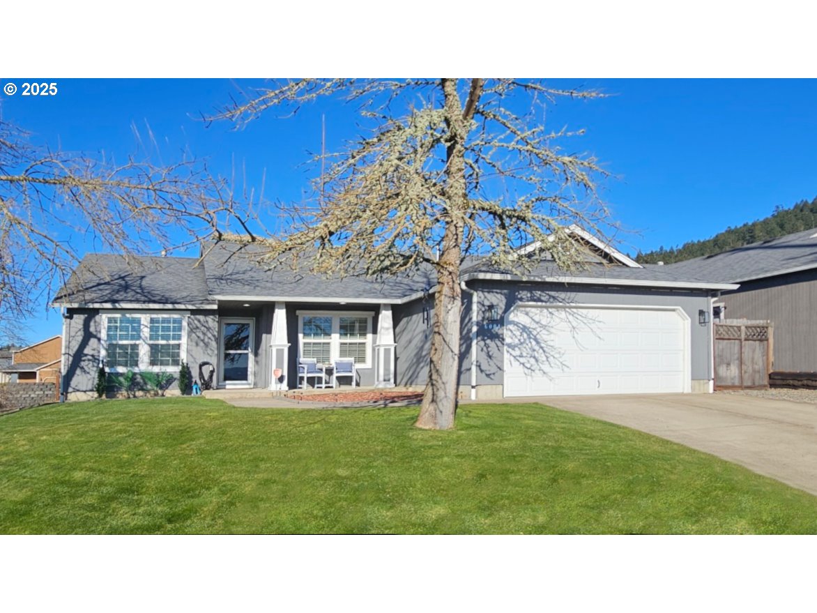 6004 Quartz Avenue Springfield, OR 97478 - Photo 1 of 19 a black and white photo of a house with a yard