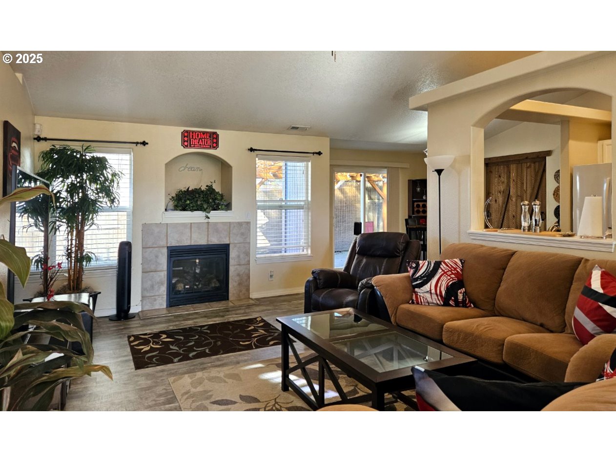 6004 Quartz Avenue Springfield, OR 97478 - Photo 2 of 19 a living room with furniture and a fireplace