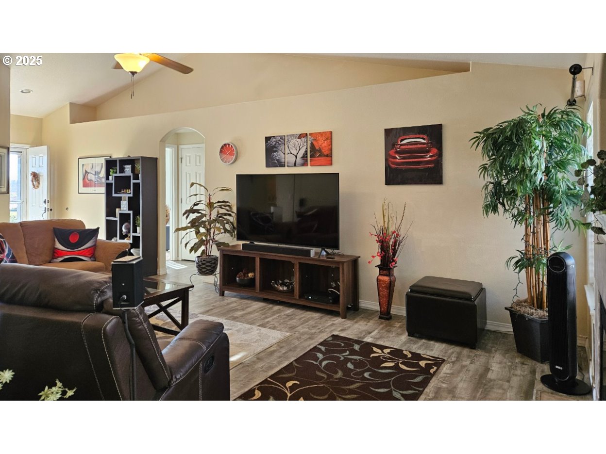 6004 Quartz Avenue Springfield, OR 97478 - Photo 3 of 19 a living room with furniture and a flat screen tv