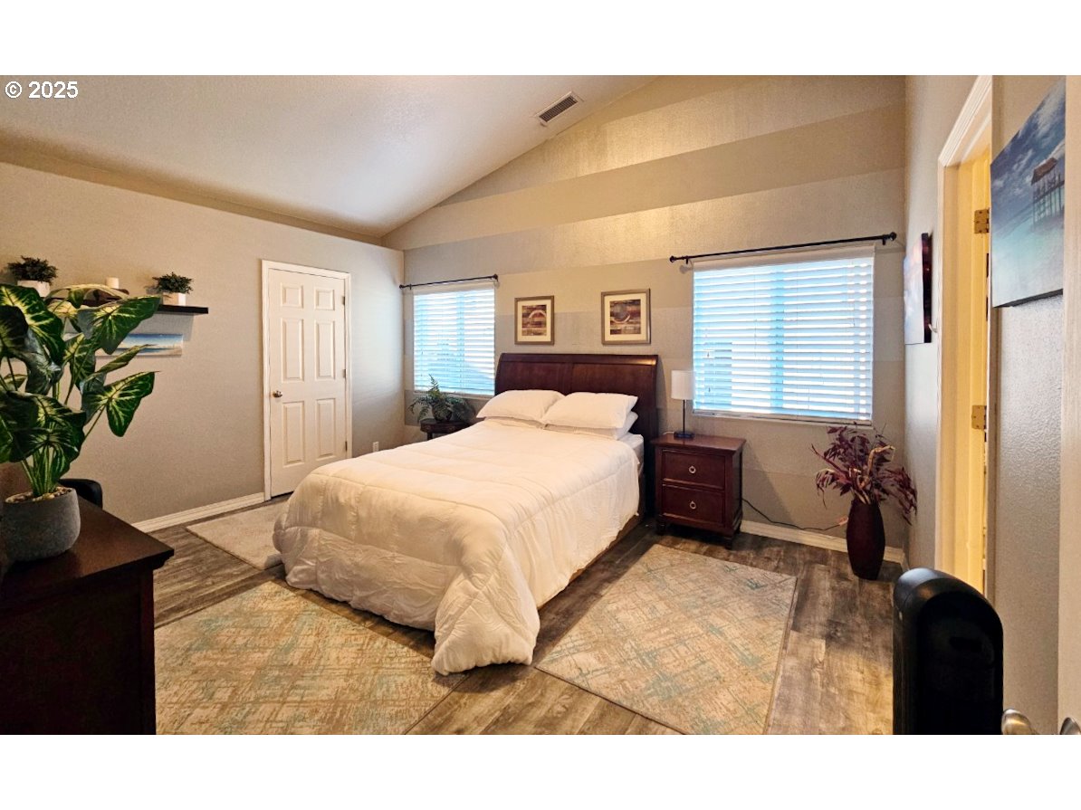 6004 Quartz Avenue Springfield, OR 97478 - Photo 7 of 19 a bedroom with a bed plant and a window