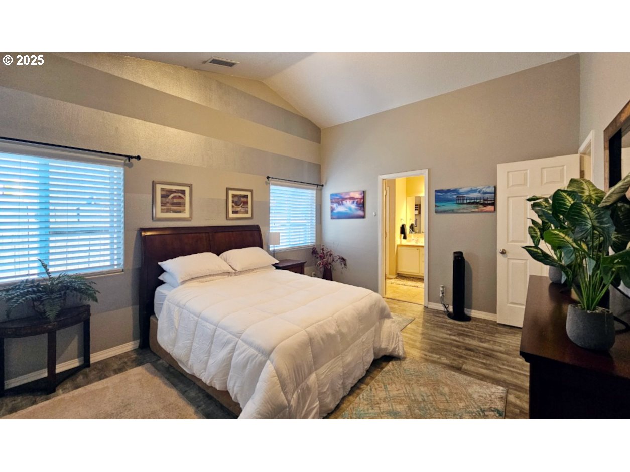 6004 Quartz Avenue Springfield, OR 97478 - Photo 8 of 19 a bedroom with a bed and a potted plant