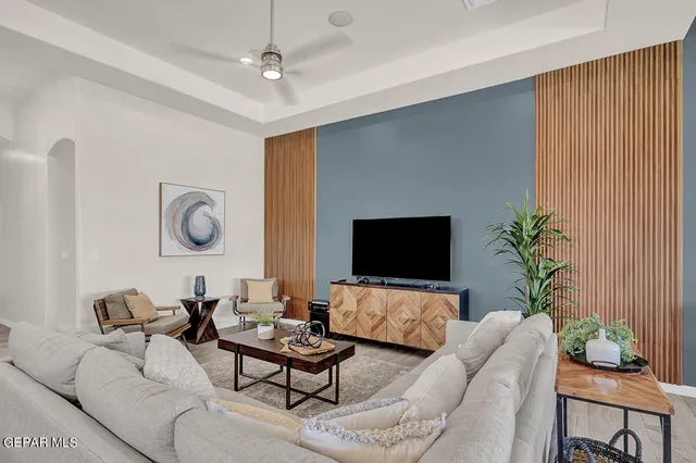 a living room with furniture and a flat screen tv